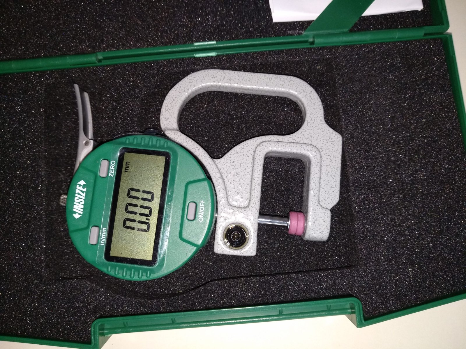 Condom length and thickness measurement station